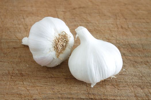 Fresh garlic on a wooden background