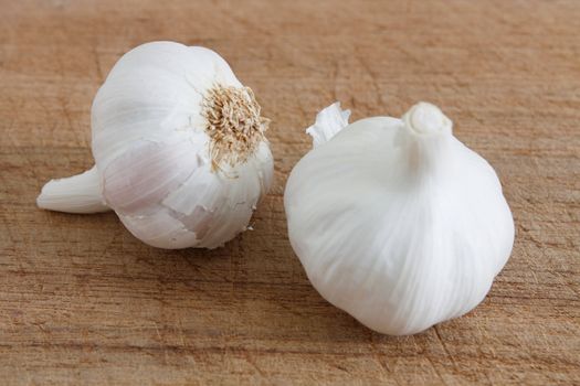 Fresh garlic on a wooden background