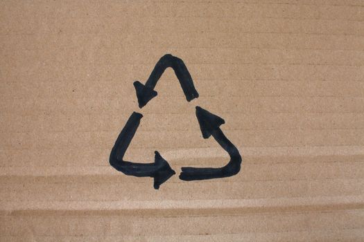 A drawing of a recycle logo