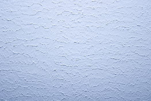 Texture of the wall painted blue color. A background