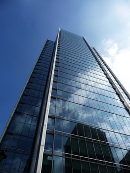 A shiny glass building in Londons Docklands.