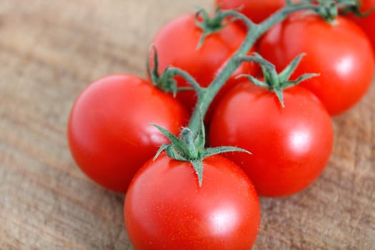 Delicious tomatoes on a chopping board