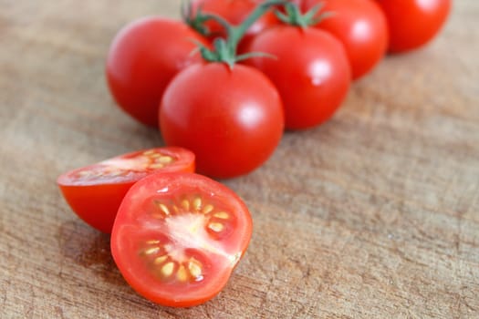 Delicious tomatoes on a chopping board