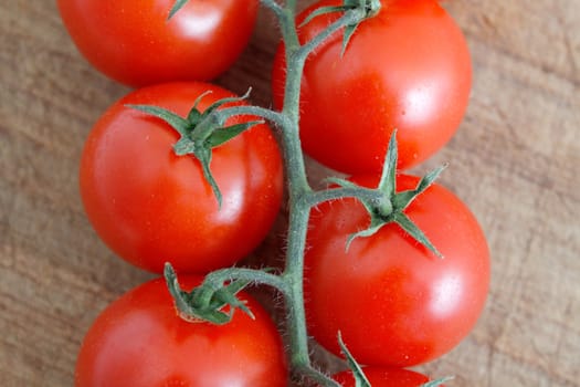 Delicious tomatoes on a chopping board