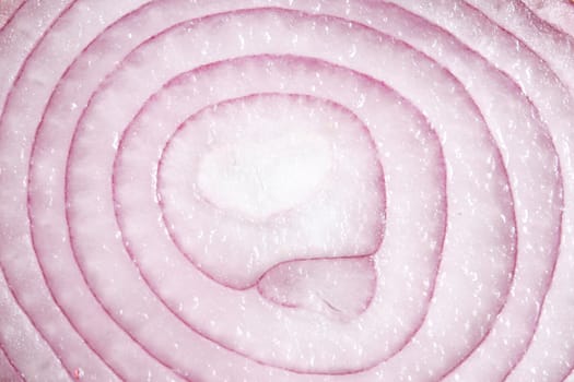A red onion sliced in half and closed up