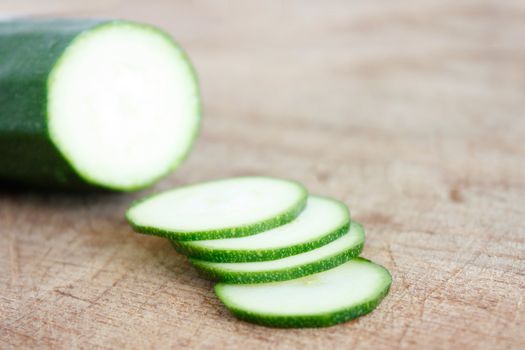 Courgettes on a wooden background