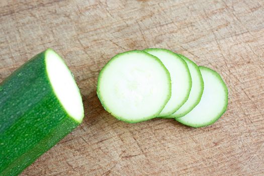 Courgettes on a wooden background