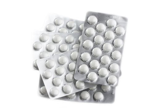 pills in blister on white background