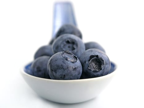 sweet bilberries on white background