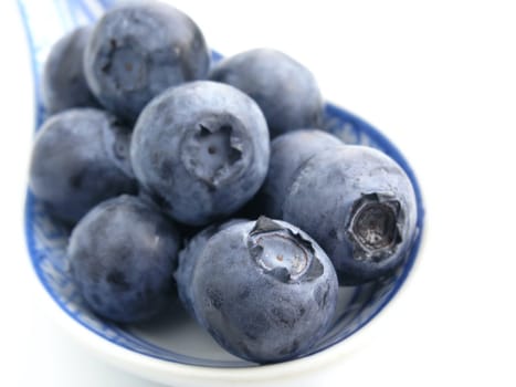 sweet bilberries on white background