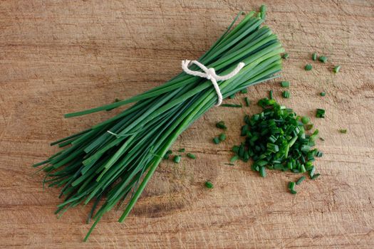 Chives on a wooden surface