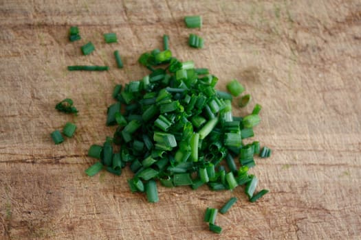 Freshly chopped fragrant chives in a horizontal composition