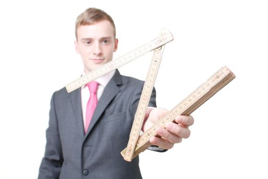 A business man with a folding ruler