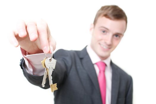 A business man giving you the keys to a home