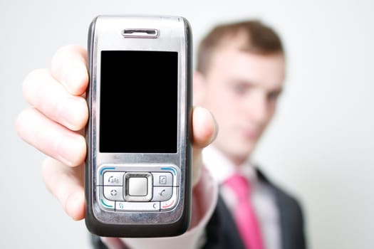 A business man holding a phone