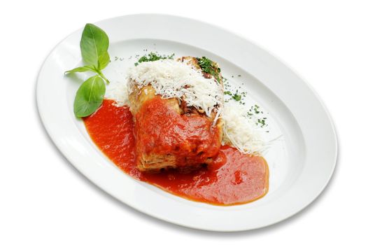 Baked pasta and meat  with sauce and basil leaf on white isolated. Path.