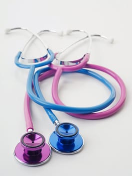 great image of pink and blue stethoscopes