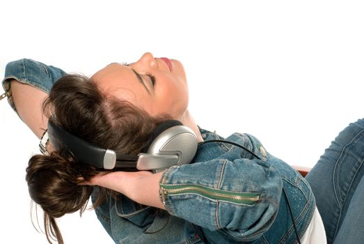 Young woman listening to music isolated on white
