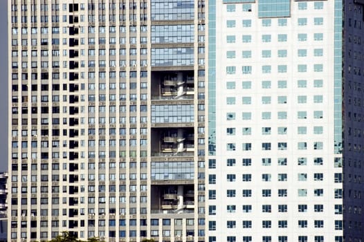 China, Shanghai - closeup photo of modern buildings with visable windows and balconies.