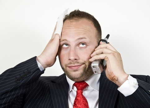 fatigued businessman with cellphone
