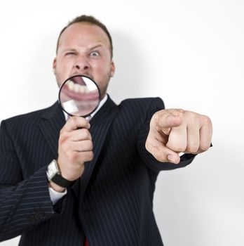 male pointing with magnifying glass
