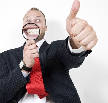 man indicating goodluck with magnifier
