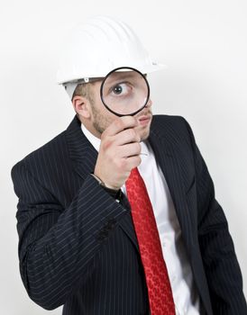 architect with magnifier on isolated background
