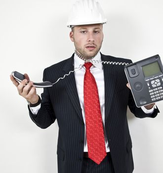 wired phone wrapped around neck on isolated background
