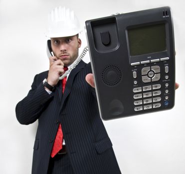 man holding wired phone on isolated background
