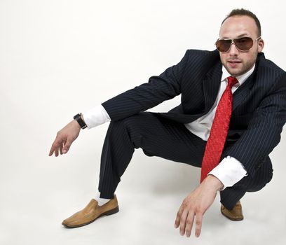 man in sitting pose on isolated background
