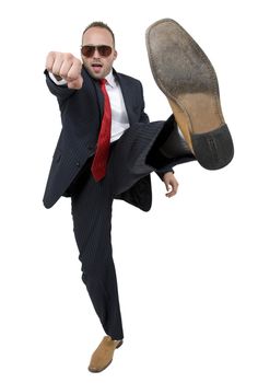 businessman kicking on an isolated background