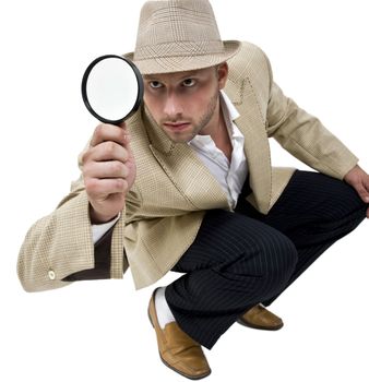 man with fedora hat and magnifier on isolatetd background
