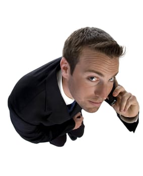 businessman busy on phone call and looking upwards on an isolated white background