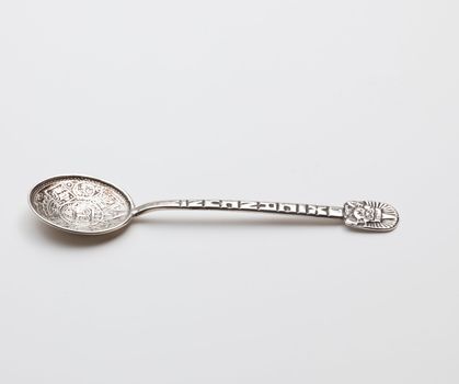 Old fashioned sterling silver object being a decorated mexican spoon from Cancun