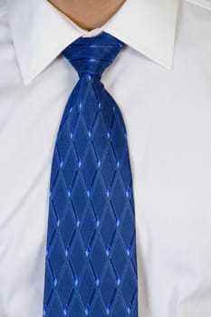 close up of businessman's tie on an isolated white  background