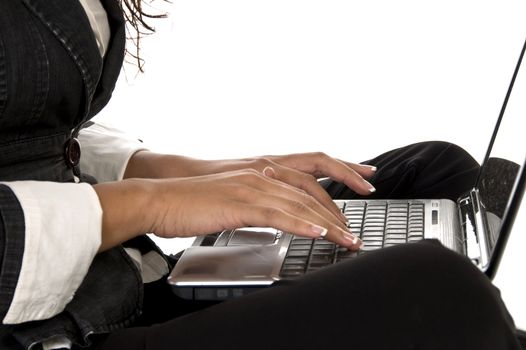 female working on laptop against white background