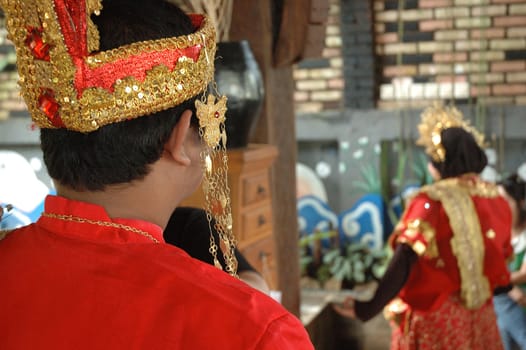 bride and groom wearing traditional costume from makasar-indonesia