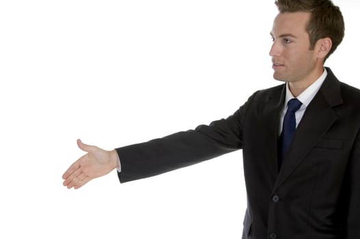 young businessman offering handshake against white background