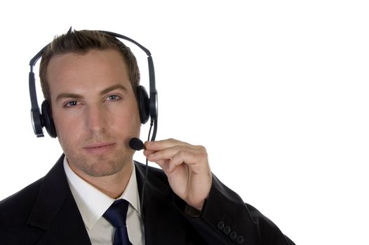 young businessman adjusting his headphone on an isolated background