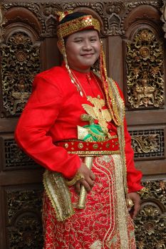 young asian groom wearing traditional costume from makasar-indonesia