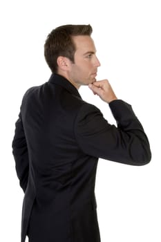 businessman with chin resting on hand on an isolated background