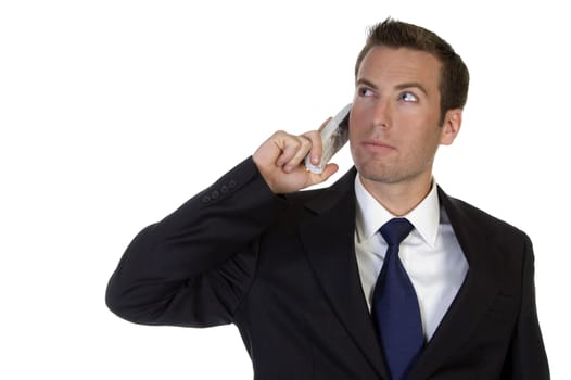 portrait of young businessman with mobile against white background