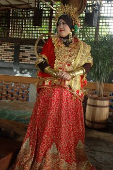 young asian bride wearing traditional costume from makasar-indonesia