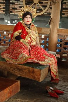 young asian bride wearing traditional costume from makasar-indonesia