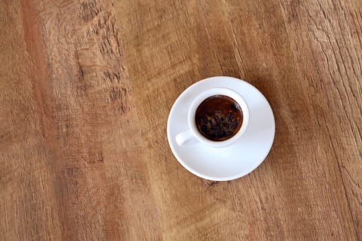 a cup on wood floor