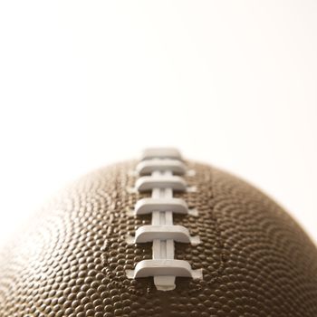Close-up of American football on white background.