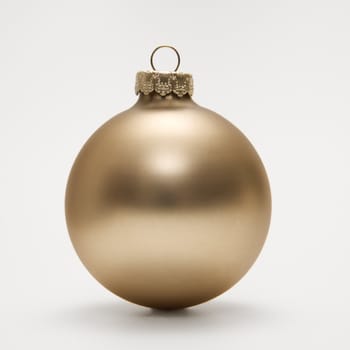 Still life of gold Christmas ornament.