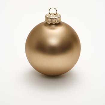 Still life of gold Christmas ornament.