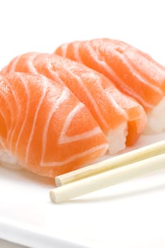 three pieces of sushi on white background