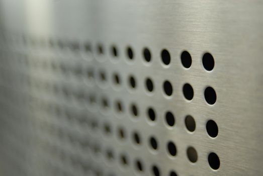 Aligned perforations on metallic surface